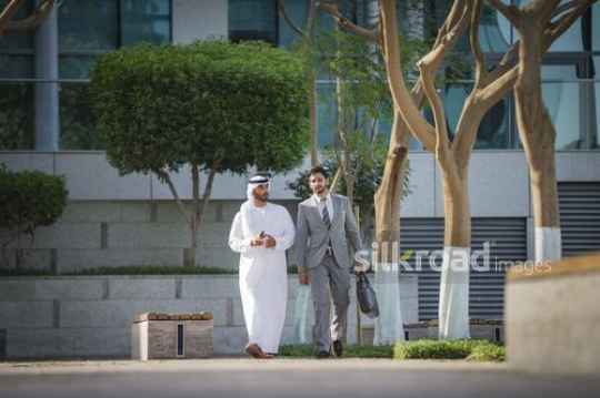 Two Employees walking together outside |-