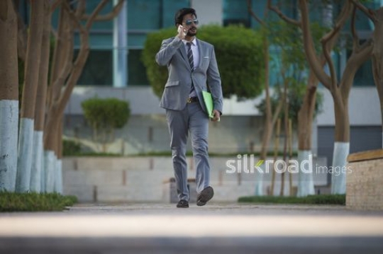 Businessman talking on the phone|-
