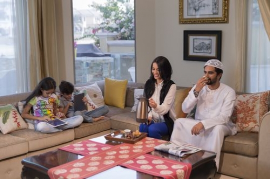Arabian family sitting together|-