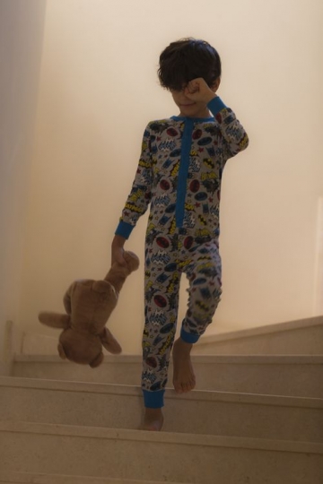 Young arab boy walking down the stairs |-