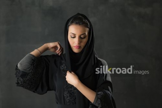 Medium Shot of a Middle Eastern woman dressed in the traditional attire|