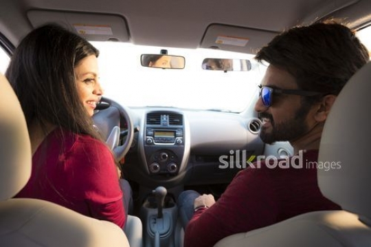 Student taking her driving lesson|-