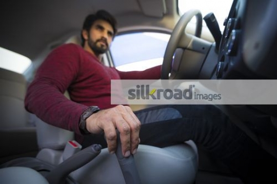 Young Expat inside the car|