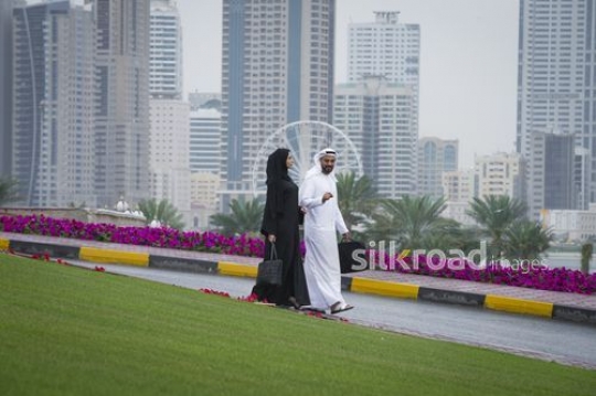 Businessman and business woman walking together |-