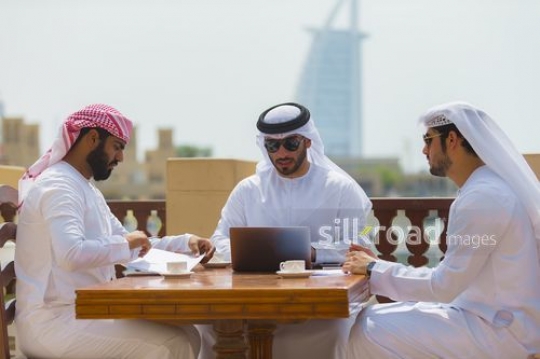 Business people during a meeting with a landmark in the background|
