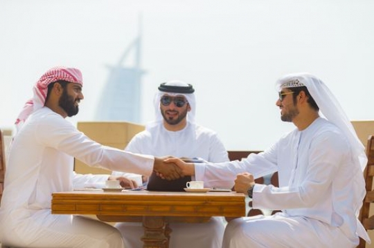 Arab business men during a client meeting|