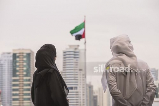 Middle Eastern man and woman representing their country|-