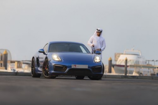 Arab man closing the door of his car |-