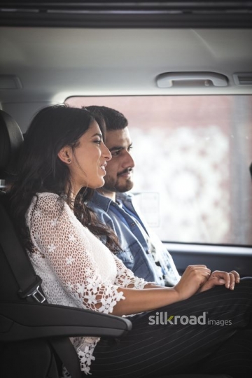 Two people sitting inside the car|-