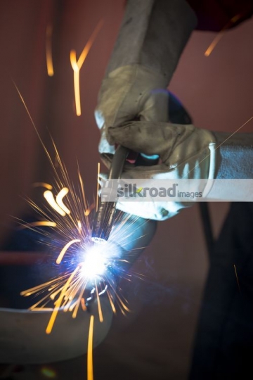 Using Machine to cut through the metal|