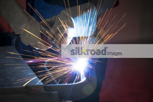 Engineer at work at the car workshop|