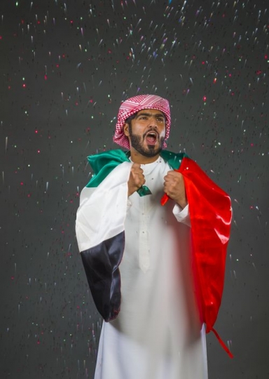 Middle Eastern man excited celebrating the UAE National Day