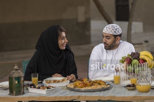 Arab woman talking to her husband|-