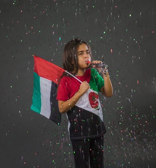 Girl excited celebrating the UAE National Day