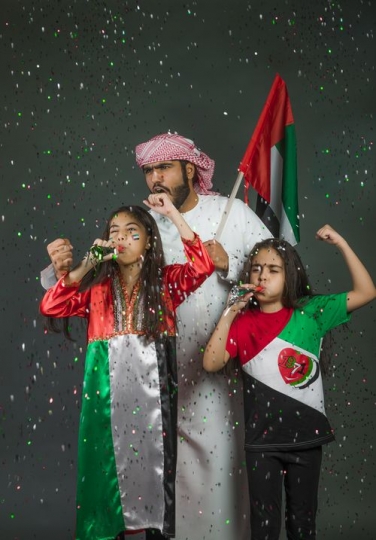 Family excited together celebrating the UAE National Day