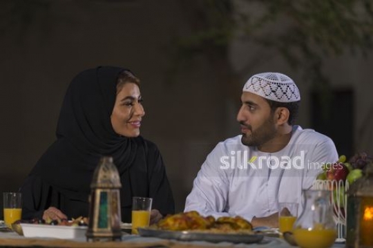 Arab woman and man sitting together |-