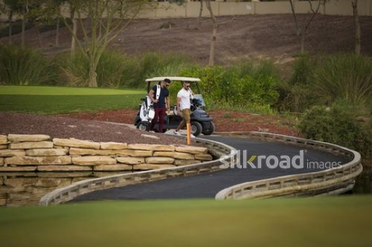 Young Middle Eastern men walking at the Golf Resort|-