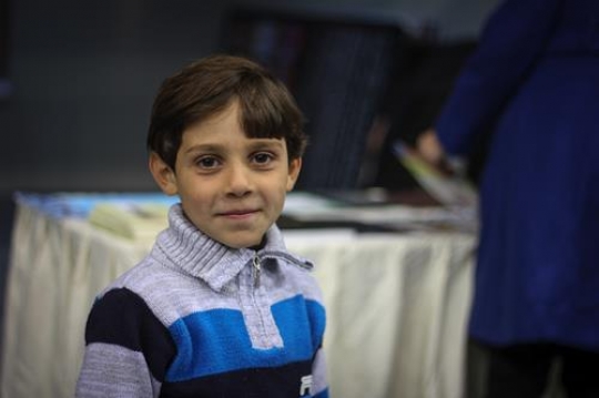 young boy smiling to the camer