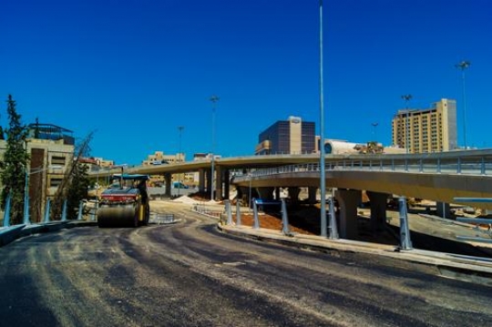 orange road-roller on repairin