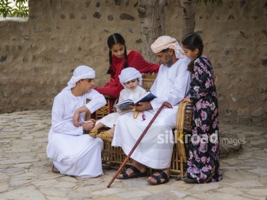 Grandfather teaching kids|-