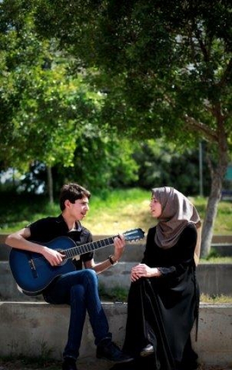 Palestinian Youth Playing Guitar