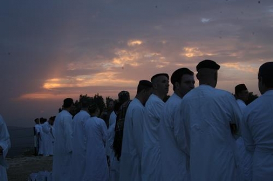 members of the Samaritan community march atop Mount Gerizim, above the West Bank city of Nablus,