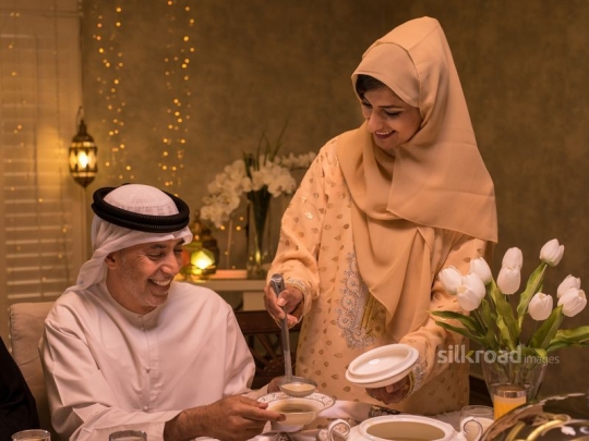 Daughter serving mushroom soup|-