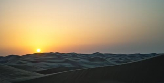 Sunset on artistic desert dune
