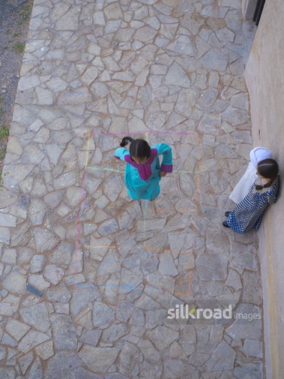 Little girl jumping|-