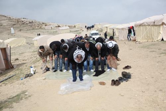 Palestinian demonstrators praying at Bab al-Shams or Gate of the Sun in Arabic, in a bid to draw attention to Israeli plans to boost settlement building in the West Bank area.