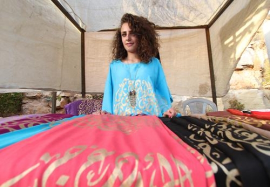 Girl selling fabric