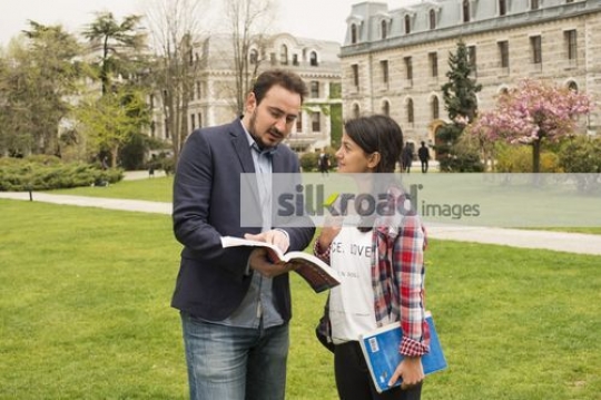 Woman talking to the professor |