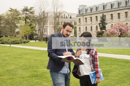 Professor talking to the student |