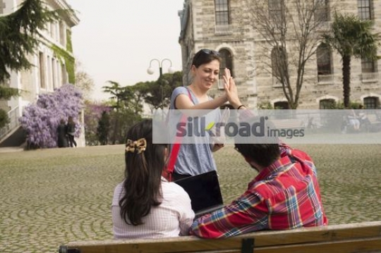 Student giving a high five to the man|