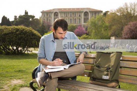 Man studying from the book|