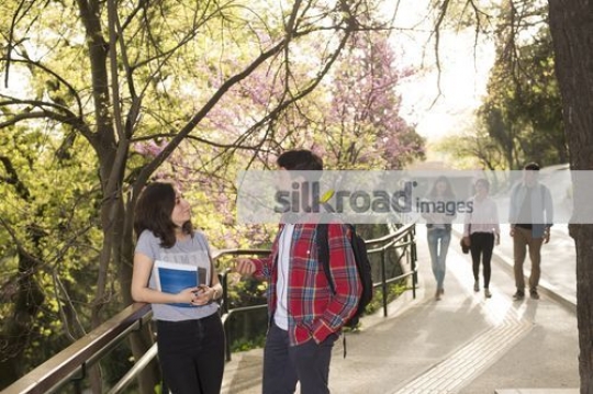 Two students talking to each other|