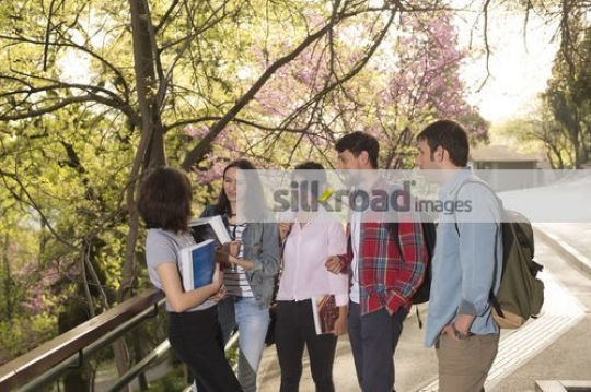 University Students talking to each other|