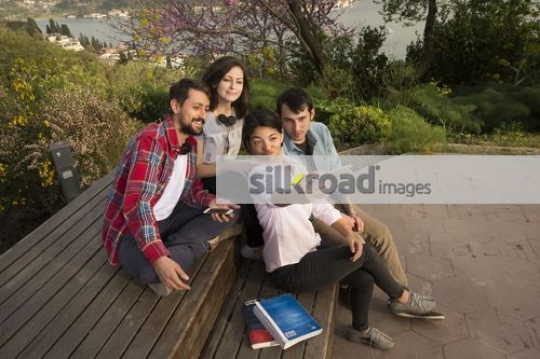 Group of people taking a selfie together|
