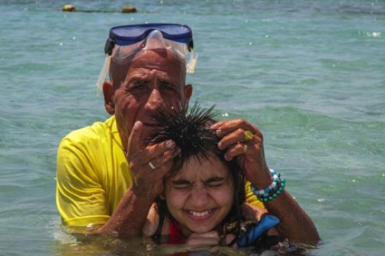 granddad with daughter in the sea