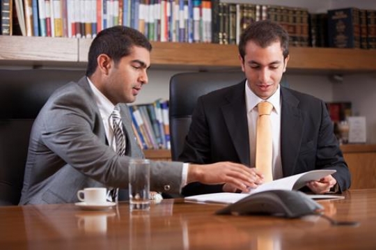 Young Executives Discussing Report