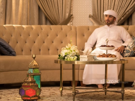 Man sitting on sofa|-