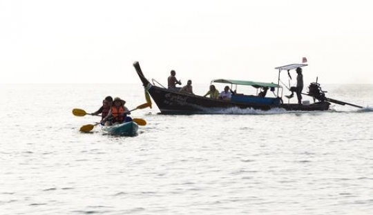 traditional boat with a paddlers