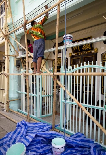 worker painting restaurant ent