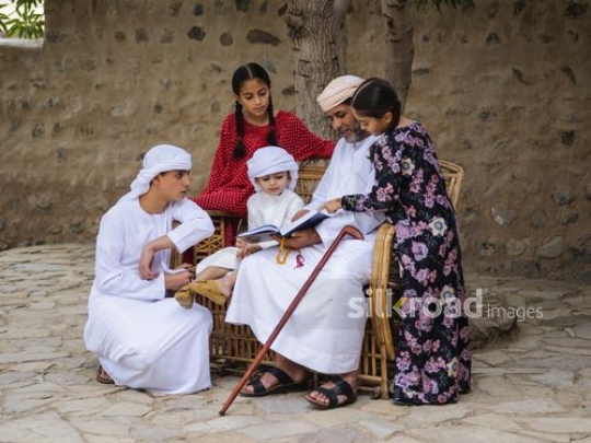 Kids around grandfather|-