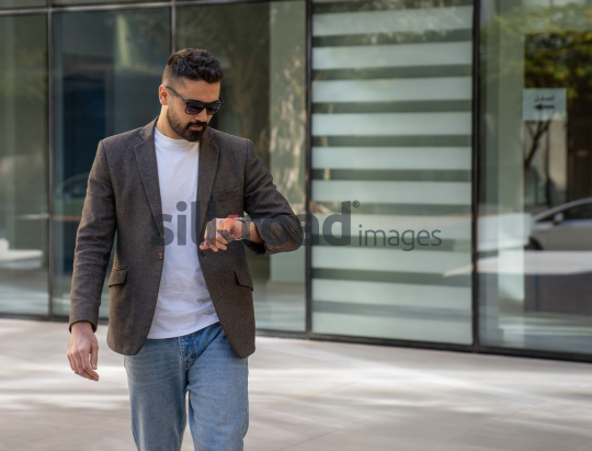 Close-Up of a Professional Man Exiting a Corporate Building