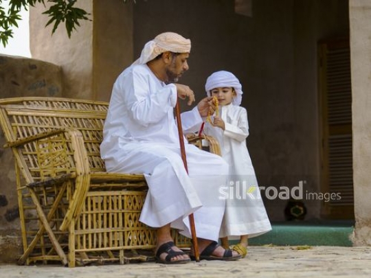 Little boy with grandfather under the tree|-