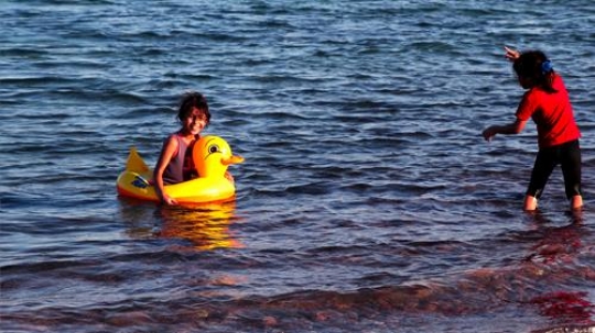 two girls playing in the sea