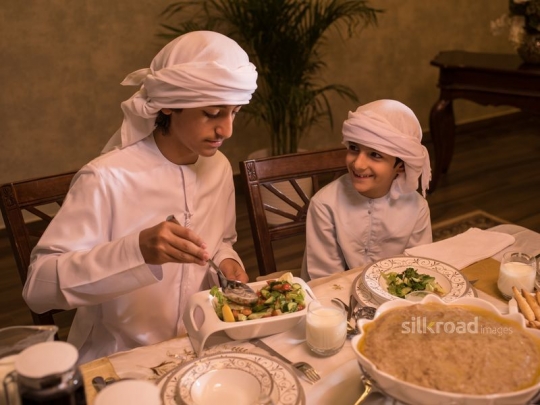 Brothers having salad|-