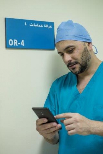 A Surgeon Making a Phone Call 