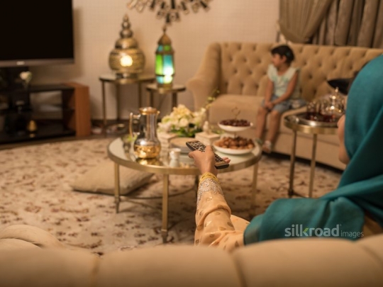 Mother watching TV|-